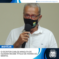 O ESCRITOR CARLOS MINGUTA DE OLIVEIRA RECEBE TÍTULO DE HONRA AO MÉRITO.